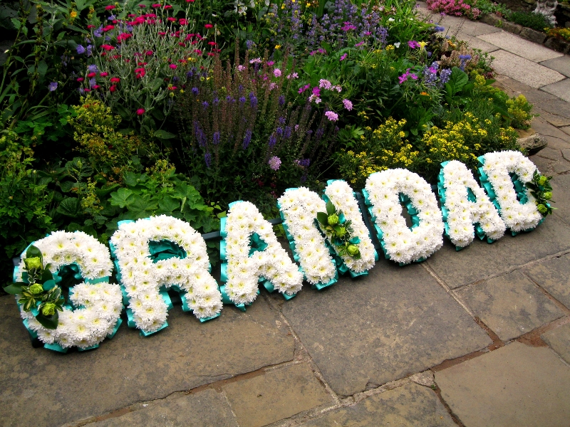 White carnations reads Grandad